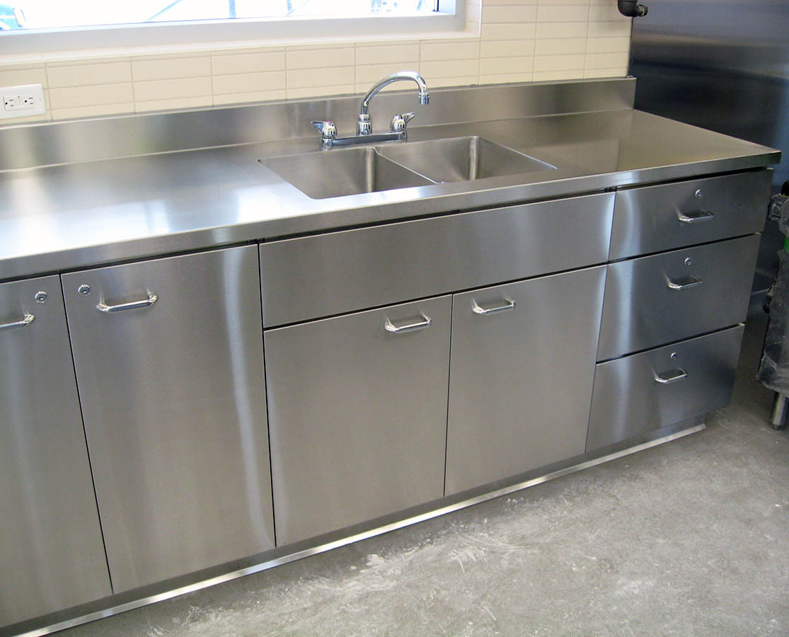 stainless steel kitchen sink and cabinet